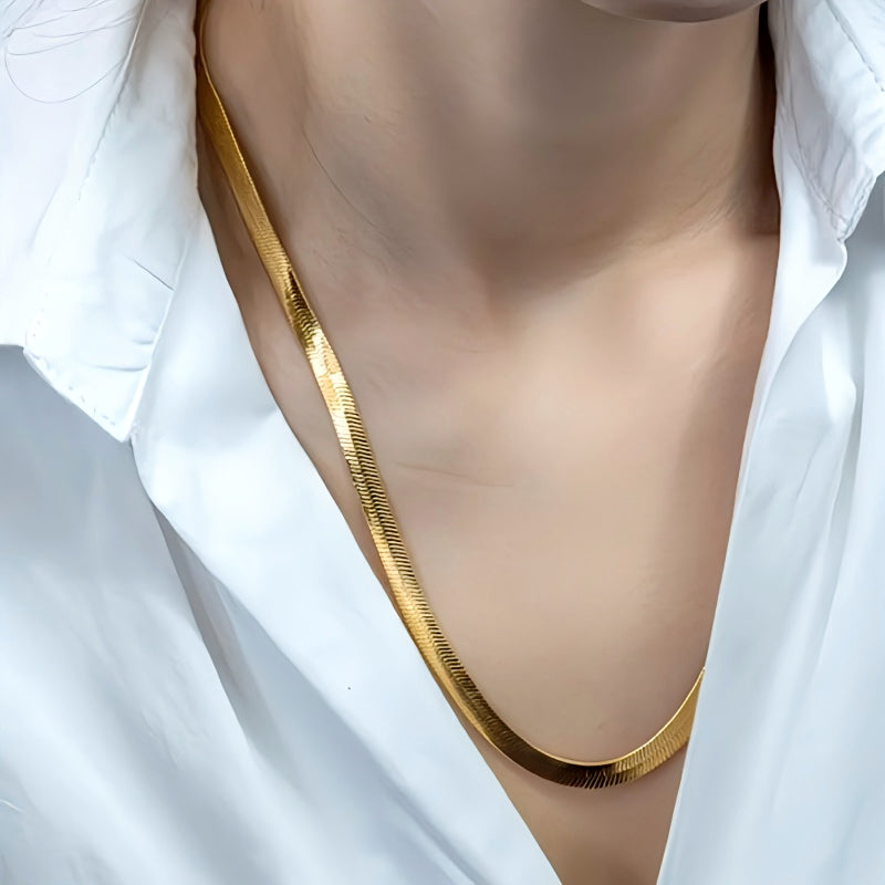 This 925 Sterling silver 18K Gold 4MM Flat chain Necklace for Women is a stunning piece of jewelry that combines elegance and sophistication. Crafted with precision, this necklace exudes luxury and style, making it a versatile accessory for any occasion. Its unique design and high-quality materials ensure a timeless look that will elevate your outfit effortlessly.