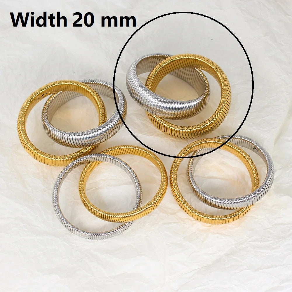 The image depicts a stylish bracelet with a ribbed design in a shiny rose gold color, suggesting it is made of 18k gold plated titanium. The bracelet features a twisted, interwoven appearance, giving it a unique and fashionable look. It appears to be a single, continuous band without clasps, showcasing its design.