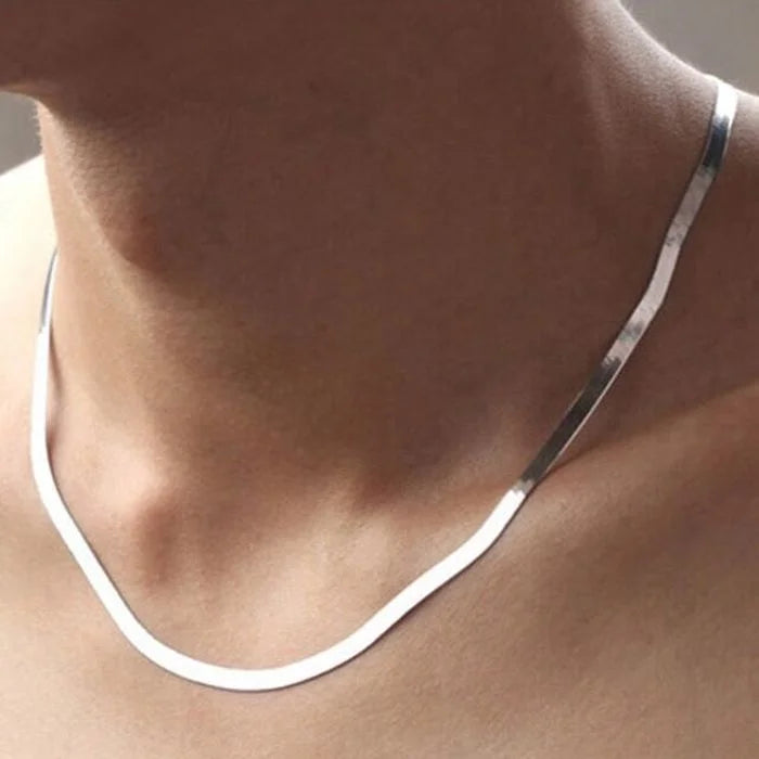 This 925 Sterling silver 18K Gold 4MM Flat chain Necklace for Women is a stunning piece of jewelry that combines elegance and sophistication. Crafted with precision, this necklace exudes luxury and style, making it a versatile accessory for any occasion. Its unique design and high-quality materials ensure a timeless look that will elevate your outfit effortlessly.